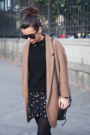 sweater layered over patterned dress / camel coat / tights
