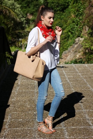 distressed denim / white T / red scarf / silver sandals
